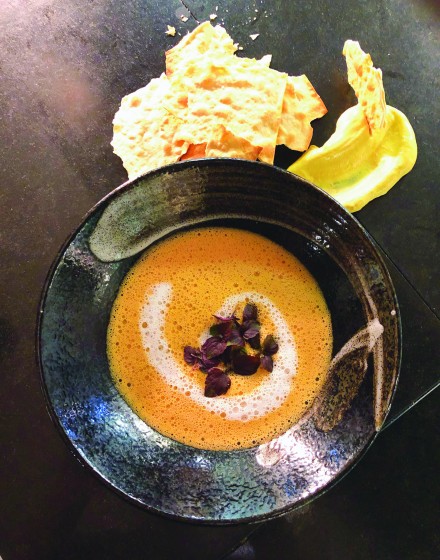 Cream soup with crackers and dip